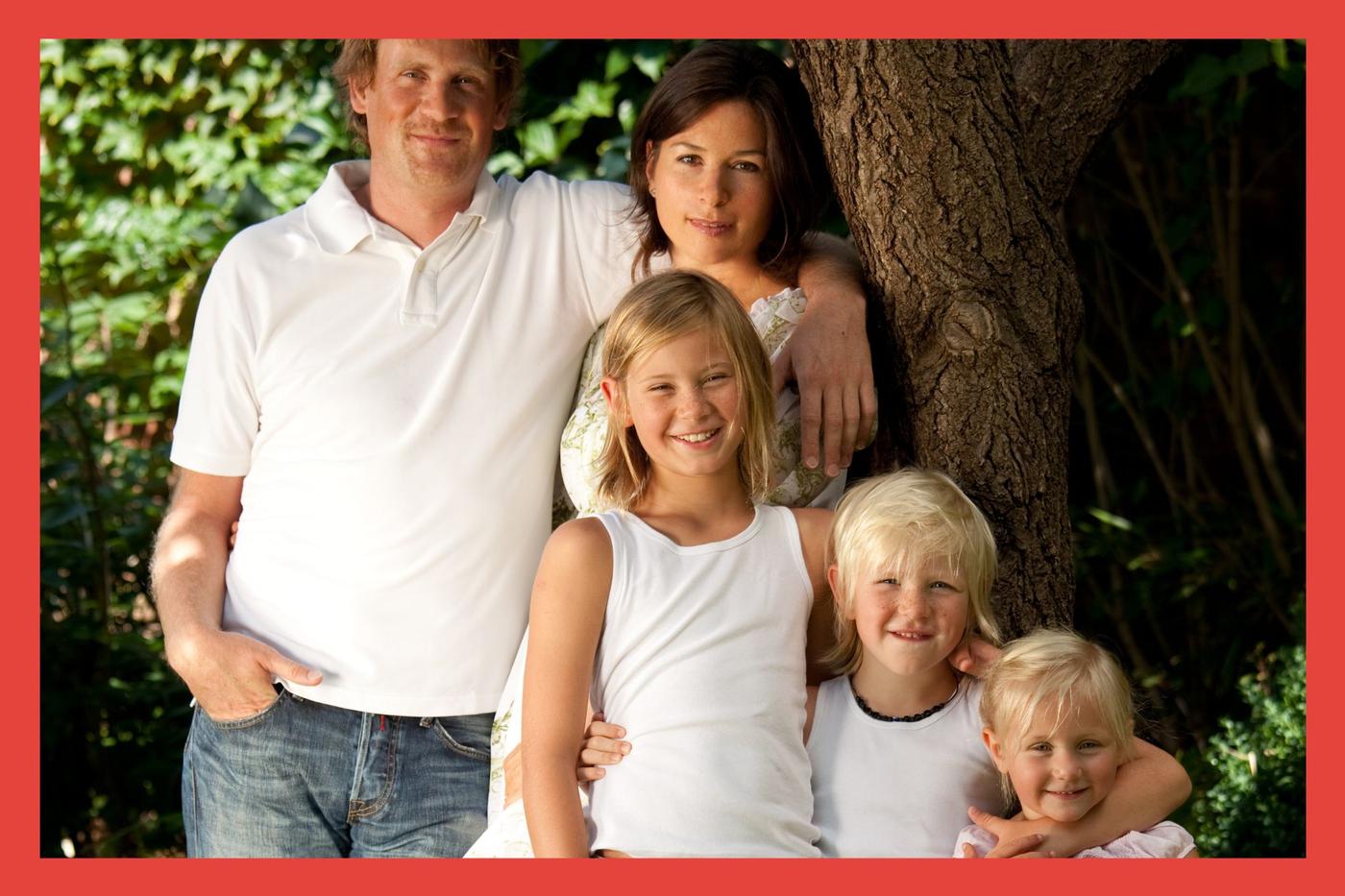 Family. Mom. Dad. Two Boys. Girl. Tree.